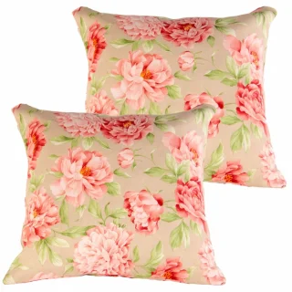 Zestaw jaśków dekoracyjnych na kanapę w kwiatowy wzór. Dominujący kolor to różowy z zielonymi akcentami.
