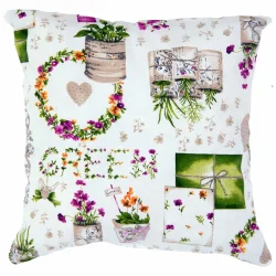 Poduszka dekoracyjna na kanapę z motywem roślinnym w kolorach zielonym i fioletowym. Pojedynczy jasiek zdobiony kwiatowymi wzorami.