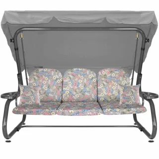 Huśtawka ogrodowa z daszkiem, wzór kwiatowy, przeznaczona do ogrodu. Cała huśtawka w jasnych kolorach z kwiecistymi poduszkami.