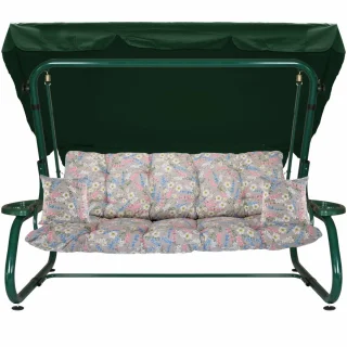 Huśtawka ogrodowa z metalowym stelażem, idealna do ogrodu. Zielony daszek i wzorzyste poduszki w kwiaty.